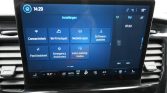 Car infotainment screen showing the Settings menu with tiles for Connectivity, Wi‑Fi Hotspot, Mobile apps, Software updates, Ford Assist, Emergency Assistance, and Valet‑parking mode (German labels).