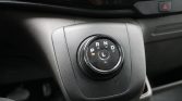 Rotary gear selector in a car with P, R, N, D, and L positions and an orange indicator near P on the center console.