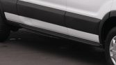 White pickup truck side view with black rocker panels and a running board along the lower body edge.