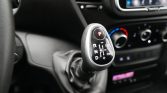 Automatic gear shifter in a car interior, showing P, R, N, D with plus/minus and ECO/PWR indicators on the lever panel