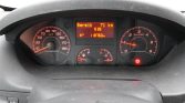 Dashboard of a car: speedometer on left, tachometer on right, central digital display shows range 71 km and odometer 118760 km with a warning light lit underneath.
