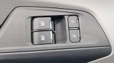 Car door control panel with two window buttons on the left and a pair of lock buttons on the right (window/door lock switches).