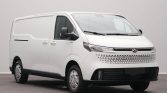 White cargo van seen from the front-left, showing a modern grille and black lower bumper area.