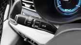 Close-up of a car's multifunction stalk with windshield wiper controls labeled HI, LO, AUTO, OFF and a turn-signal/arrow switch near the instrument cluster.