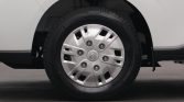 Front wheel of a white car with a silver hubcap and Toyota emblem in the center.