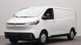 Front three-quarter view of a white commercial cargo van with a black bumper and grille pattern at the lower front surface of the vehicle