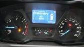 Dashboard view showing speedometer up to 200 km/h on the right and tachometer up to 6,000 rpm on the left; red brake/handbrake and fuel warning lights are illuminated; central blue info display shows 15°C, range 63 km, and trip/vehicle info with odometer reading 116,714 km; warning icons around indicate system alerts.