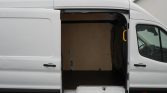 Open white cargo van with empty plywood-lined interior ready for loading, side door wide open behind the driver cab.