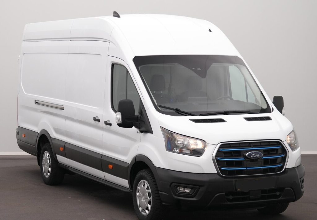 White Ford cargo van, front-left three-quarter view showing tall cargo roof and side panel.