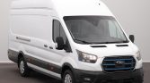 White Ford cargo van, front-left three-quarter view showing tall cargo roof and side panel.