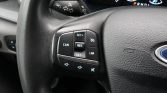 Left side of car steering wheel showing cruise control and audio buttons (CAN, SET+, SET-, RES, LIM)