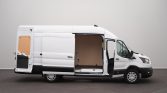 White cargo van with side door open, showing an empty wooden cargo area ready for loading in a parking area.