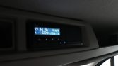 In-car digital instrument cluster showing speed 0 km/h and odometer reading 82,984.2 km.