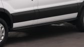 White van with black side molding and running boards along the passenger side, shown in a side view.
