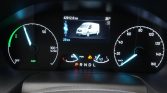 Instrument cluster with a central screen showing a white van, odometer 42,912.6 km, and speedometer up to 160 km/h