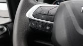 Steering wheel control cluster with a four-way arrow pad, OK button, and a row of phone, voice command, and menu/document buttons at the bottom.