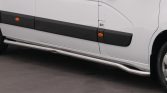 Side view of a white cargo van with black protective panels, orange reflectors, and a silver running board along the bottom.