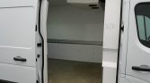 White cargo van with the side door open, showing an empty cargo area with a metal track on the wall.