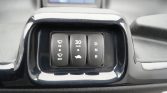 Close-up of a car dashboard panel with three buttons: left wiper controls (HI/INT), middle '30 km/h' with a car icon, and right vertical D N R gears.