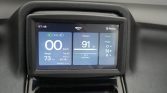 Infotainment screen in a car showing 0 km/h speed, 91% battery, gear options (D/N/R), and trip/range details on a blue UI.