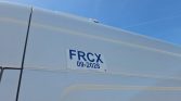 White truck trailer with a blue FRCX 09-2028 label affixed to its side.