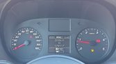 Car dashboard with speedometer (0–180 km/h) on left, tachometer on right, central digital display shows trip distance 2006.4 km, odometer 128417 km, gear PRND, and warning indicators (seatbelt, low fuel, parking brake); outside temp 28.5°C and time 10:45.