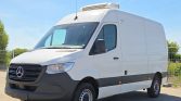 Front three-quarter view of a white Mercedes-Benz cargo van with a rooftop refrigeration unit.