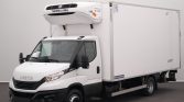 White Iveco refrigerated box truck with Thermo King unit mounted on the cab-top, in a studio setting