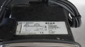 Close-up of a worn label on a forklift component, showing Baer Cargolift specifications and a small weight/measurement diagram.