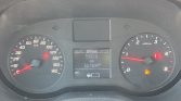 Car dashboard with two round gauges: left speedometer up to 180 km/h, right tachometer up to 5,000 rpm; center display shows 550.0 km trip, total 161,097 km, and warning lights (parking brake and fuel).