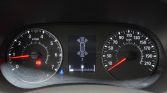 Dashboard car instrument cluster with speedometer up to 210 km/h and tachometer to 7,000 rpm; warning lights and center sensor display visible.