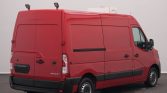 Rear three-quarter view of a red Renault Master cargo van with roof-mounted refrigeration unit, photographed indoors.]