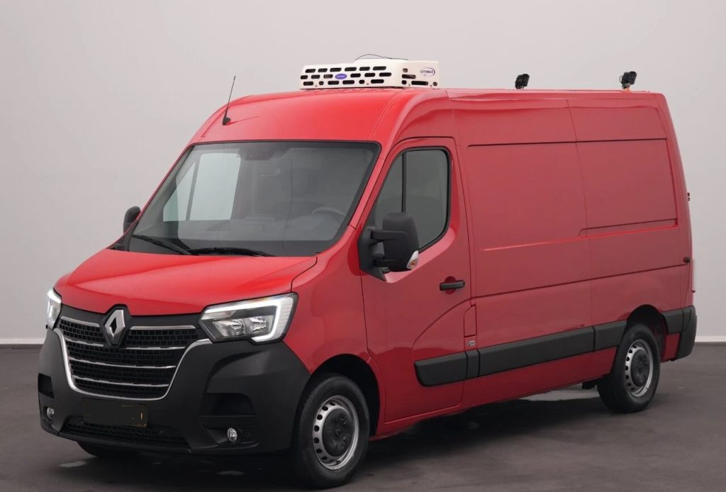 Red Renault refrigerated cargo van seen from the front-left, with a roof cooling unit and black bumper accents