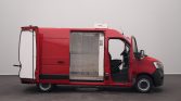 Red delivery van with side cargo door open, revealing a refrigerated metal compartment inside.