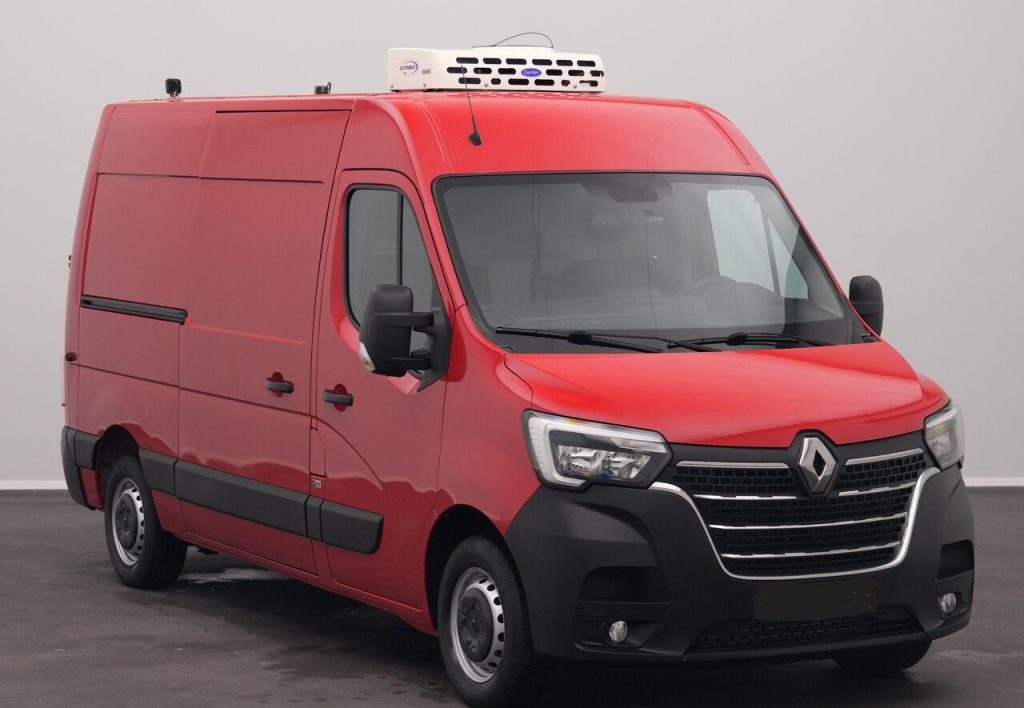 Red Renault cargo van with a white refrigerated unit on the roof, parked indoors.