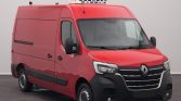 Red Renault cargo van with a white refrigerated unit on the roof, parked indoors.