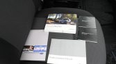 Car seat with Renault manuals and brochures: Renault MASTER, two 70mai Dash Cam 1S manuals, and Radio Connect R & GO booklet.