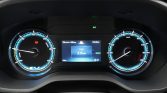 Car instrument cluster: left tachometer with EV badge, center digital display shows Trip 1 at 3.0 km, READY indicator lit, right speedometer up to 180 km/h.