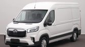 Front-right view of a white cargo van with high roof and black grille, set against a neutral backdrop.