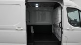 White cargo van with side sliding door open, revealing an empty, clean cargo area.