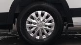 Close-up of a silver multi-spoke alloy wheel with a Hyundai center cap and black tire on a white vehicle.