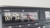 Close-up of a vehicle multifunction display: odometer reads 340,785.7 km, current speed 0 km/h, time 09:23, with VDO branding and a QR code on the right.