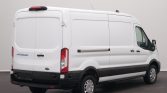 White Ford Transit cargo van photographed from the rear-right side in a studio setting.