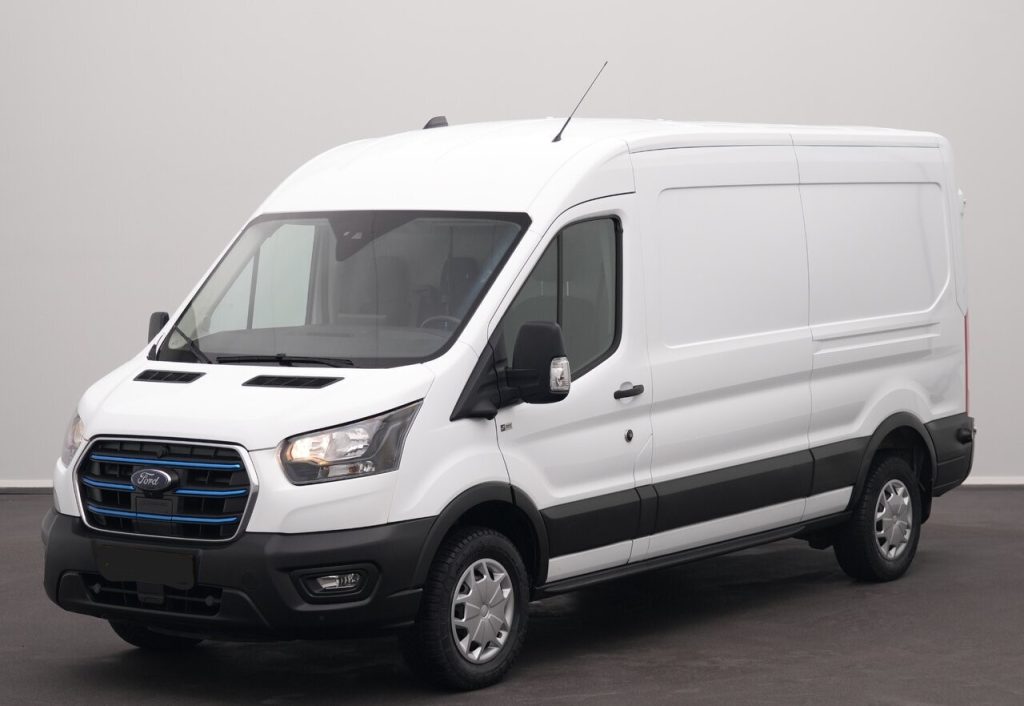 White Ford cargo van photographed from a three-quarter front angle, showing its large cargo area and black bumper trim