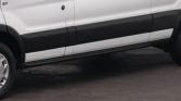 White van side with black rocker panel and running board along the bottom edge