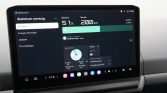 Car touchscreen showing EV dashboard: battery at 51% and 200 km range with charging info (Dutch labels).