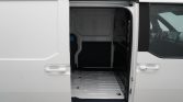 White cargo van with side door open, showing an empty silver cargo area ready for loading