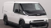 White Kia cargo van shown from the front-left in a studio setting