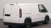 White cargo van shown from the rear-side, with rear doors closed and black bumper, wheels, and side profile visible.