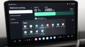 Dashboard touchscreen showing EV information: battery 51%, range 200 km, and an Apps grid on a dark interface.